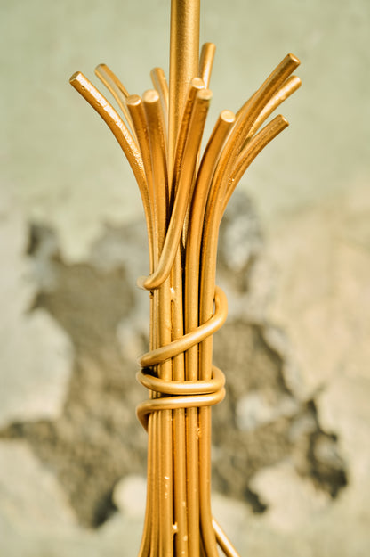 Close-up of a woven gold object with a blurred background