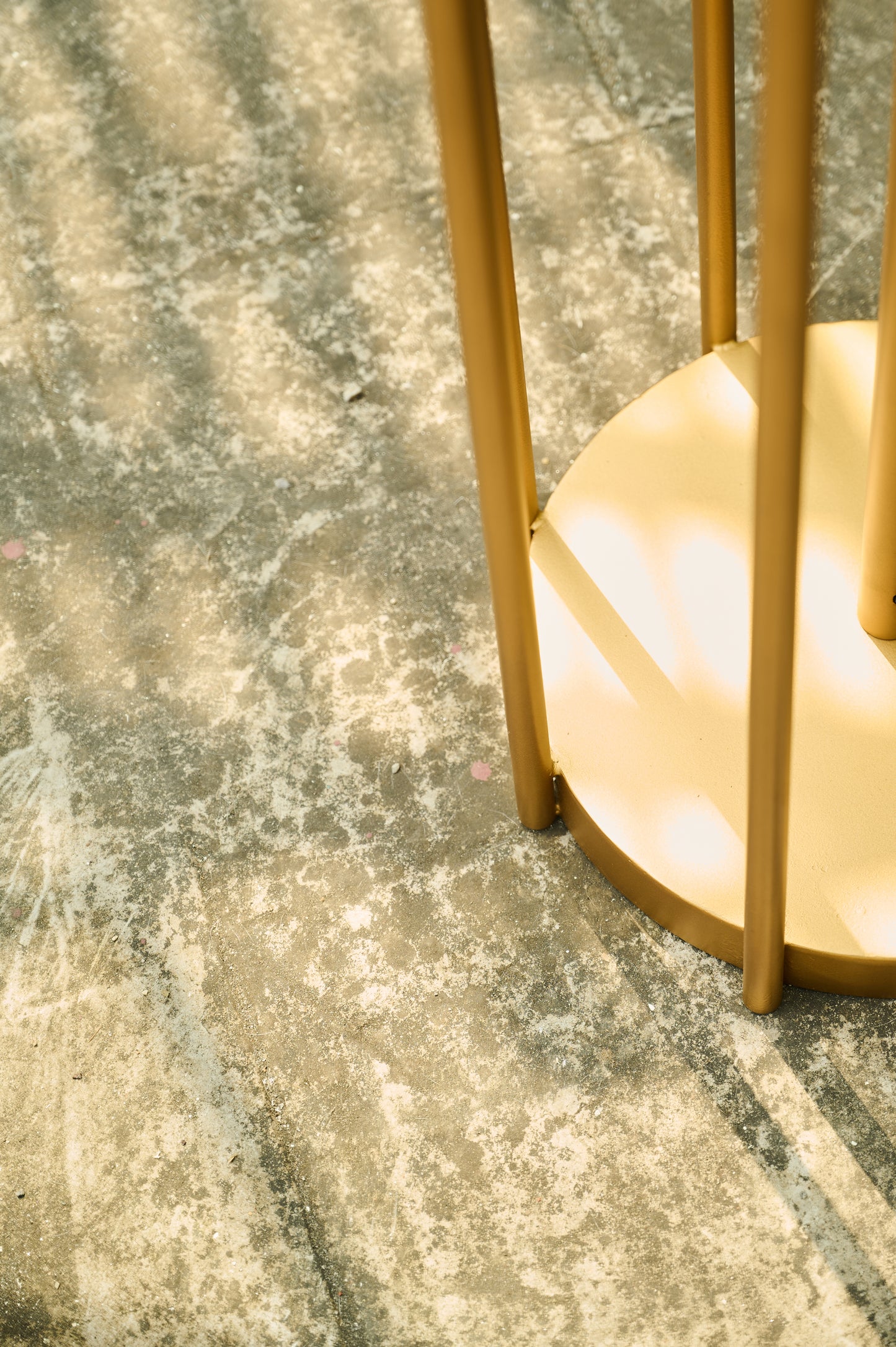 Gold decorative item on a textured surface