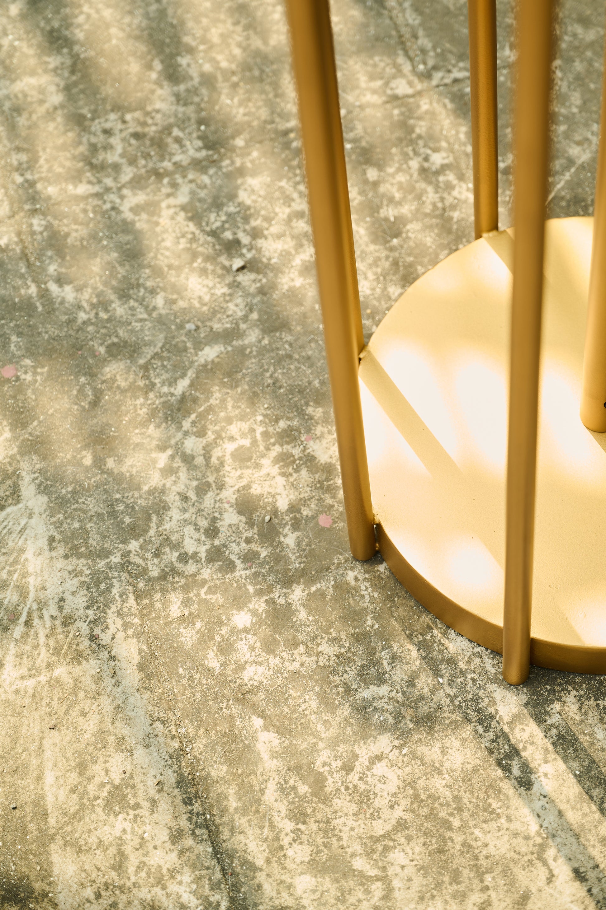 Gold decorative item on a textured surface